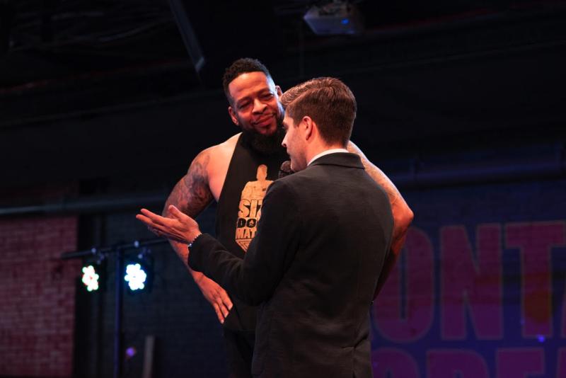 Kevin Cerrito interviews wrestler in the middle of ring