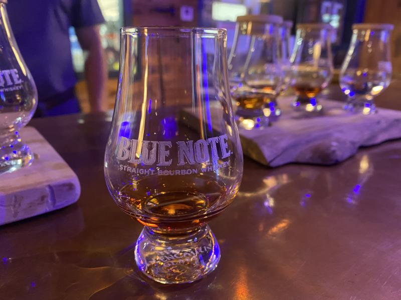 up close shot of tasting glass with bourbon in it