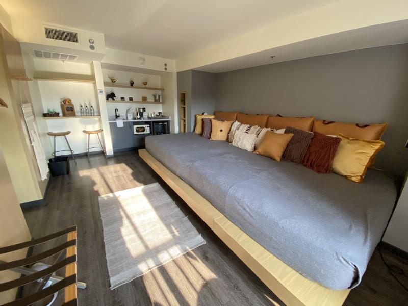 jungle room suite hotel room with very large bed - two beds combined intro one