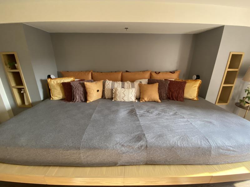 mega sized bed of two king size beds turned into one