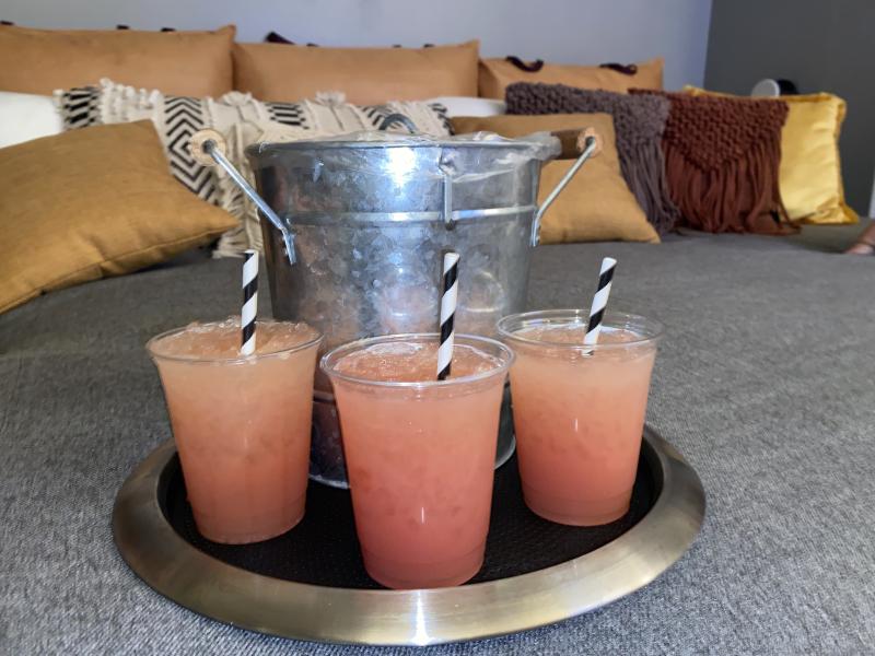 three cocktails on try with ice bucket