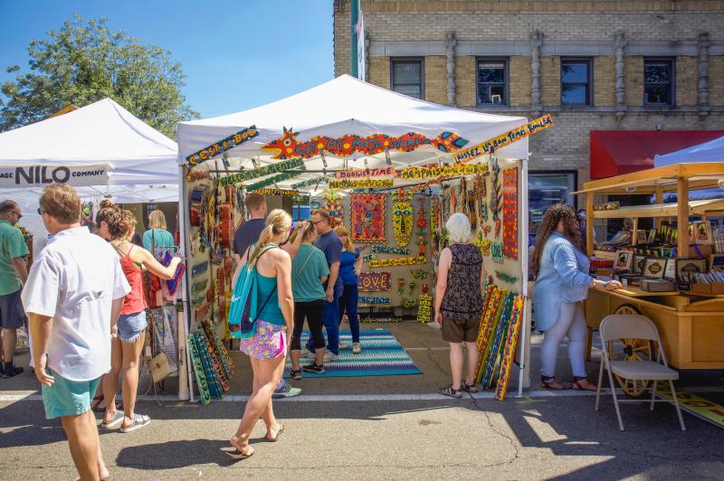 market shop set up at Cooper young festival where people are shopping