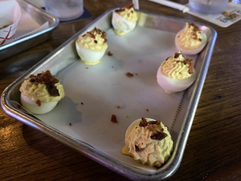 six deviled eggs on a plate