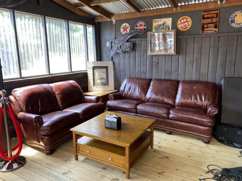 "vip" area with dive bar vibes -- leather couches