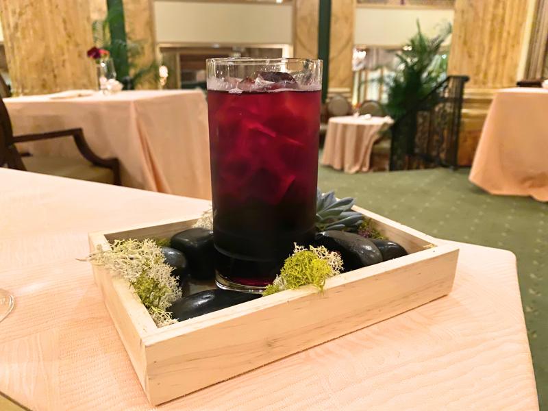 cocktail dressed up with container it's sitting in