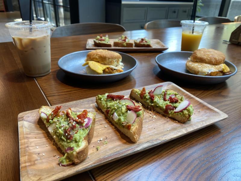 breakfast at talk shop avocado toast and biscuit sandwich