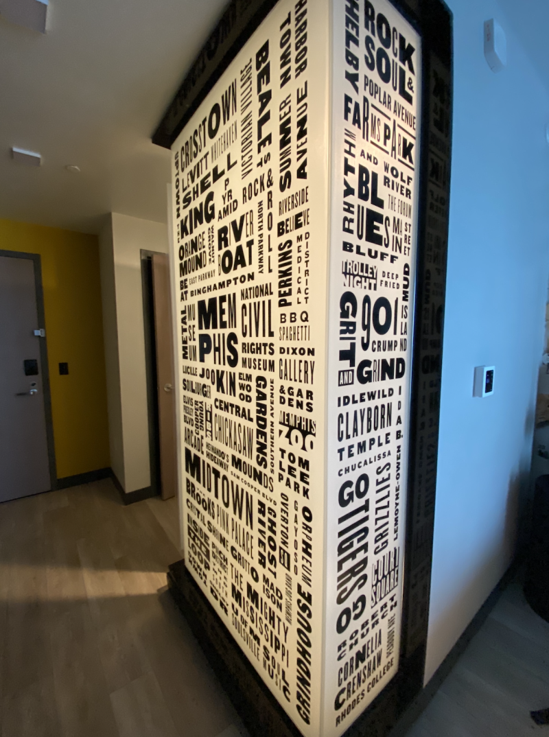 interior image of shower wrapping with Memphis-themed words