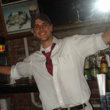 bartender smiles for picture