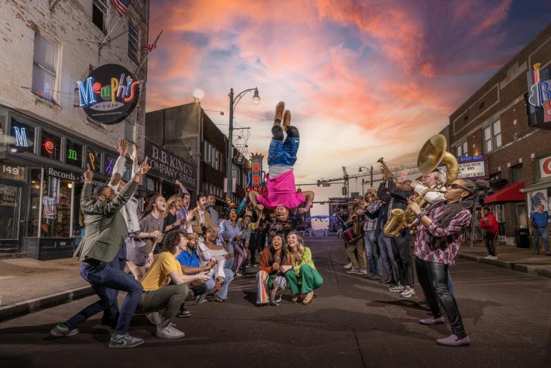 people lined up on beale street with beale street flippers jumping over their heads