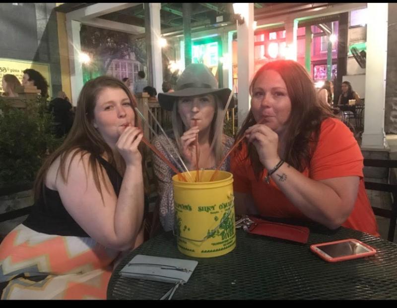three girls pose with diver bucket