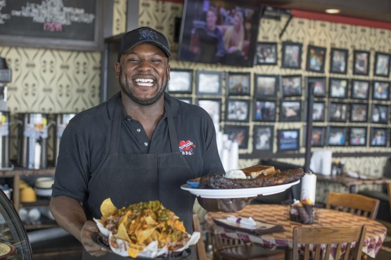 man holding One  Only BBQ