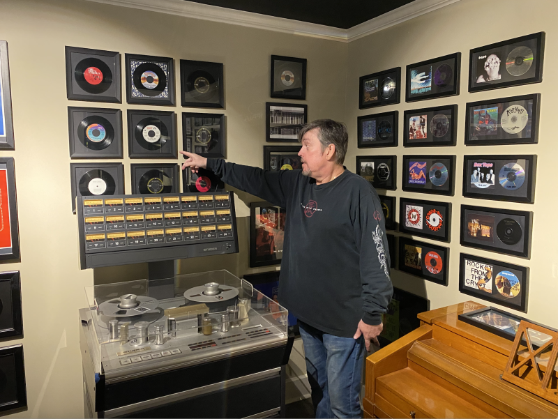 Brad Dunn points out an album on the wall at American Recording Studio