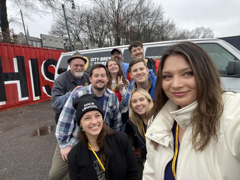 group photo in front of bus