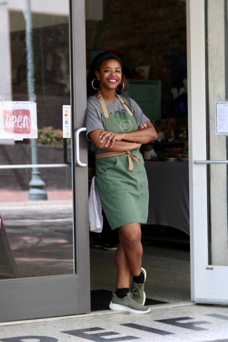 Cristina McCarter standing in storefront door