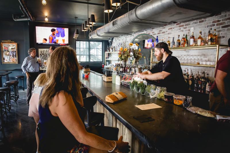 people sitting at bar at BarWare