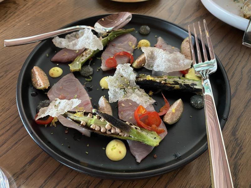Hamachi Crudo with pickled peppers, lemon aioli, and charred okra