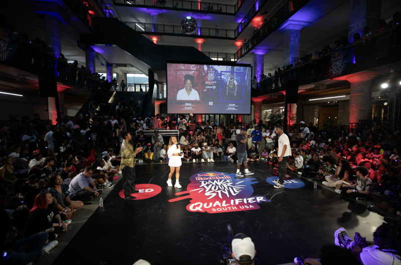Red Bull dance stag set up in crosstown concourse surrounded by spectators