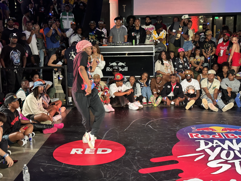 man dances on red team dot