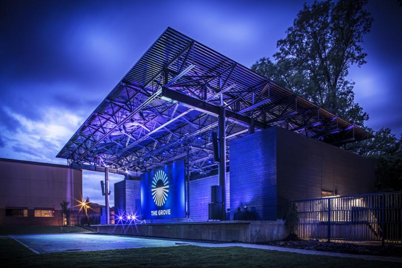 The Grove stage at GPAC lit up blue at night