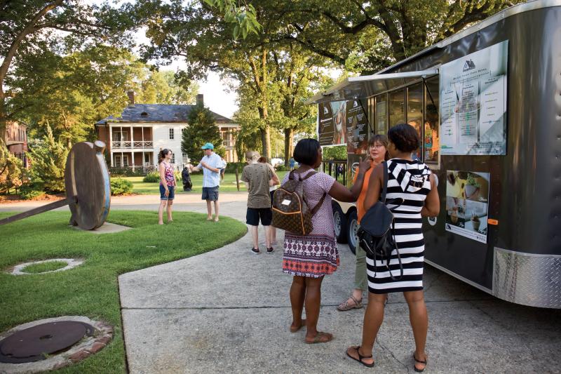 people and Food trucks at the Metal Museum