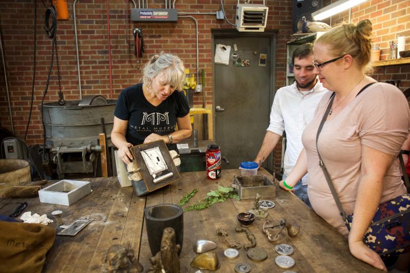 people Observing work at the Metal Museum