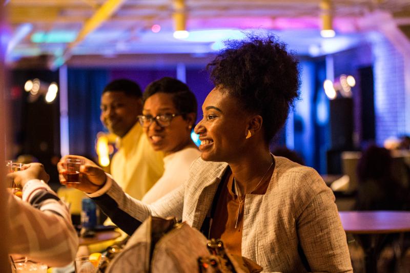 woman holding Old Dominick taster