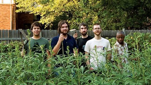snowglobe band poses for photo in garden