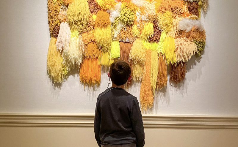 child looks at art in the Dixon gallery