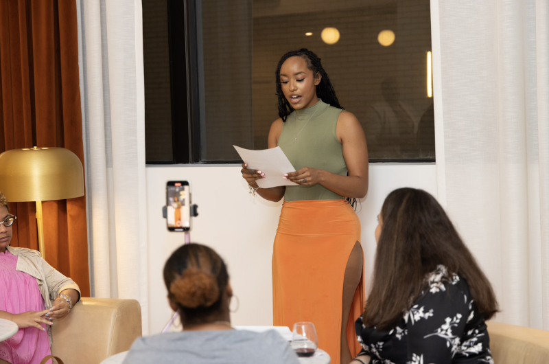 woman reads to group