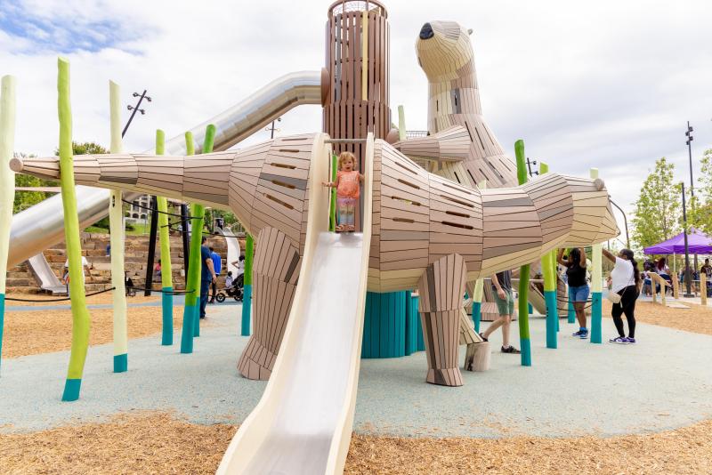 A slide swoops down from an otter-themed playground structure at Memphis' Tom Lee Park