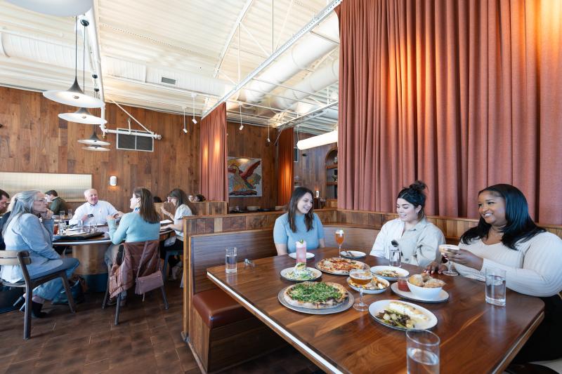 wide shot of people dining at nice restaurant