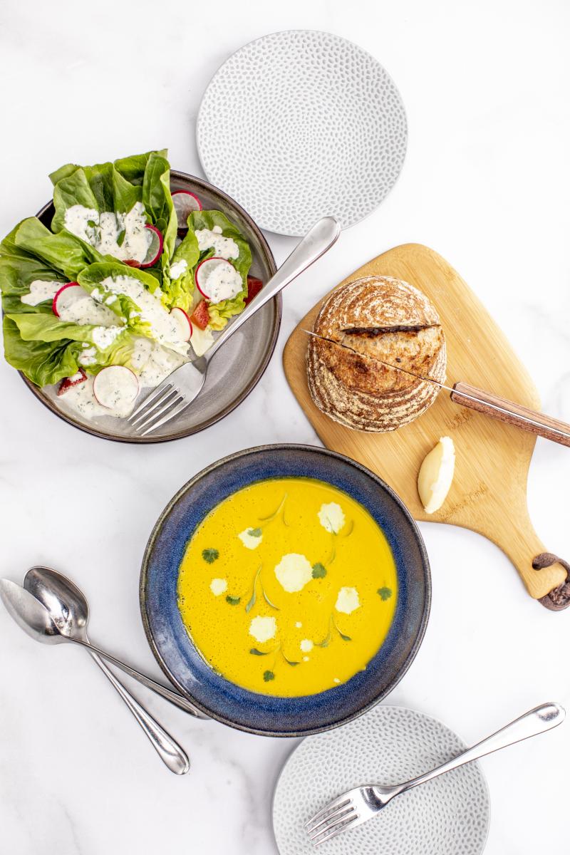 soup, salad, bread on plate
