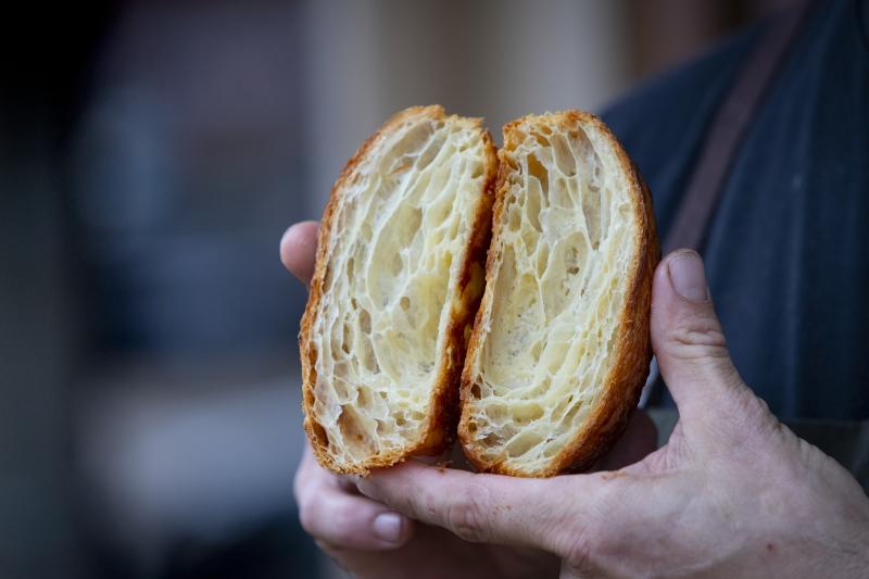 man holding fresh bread