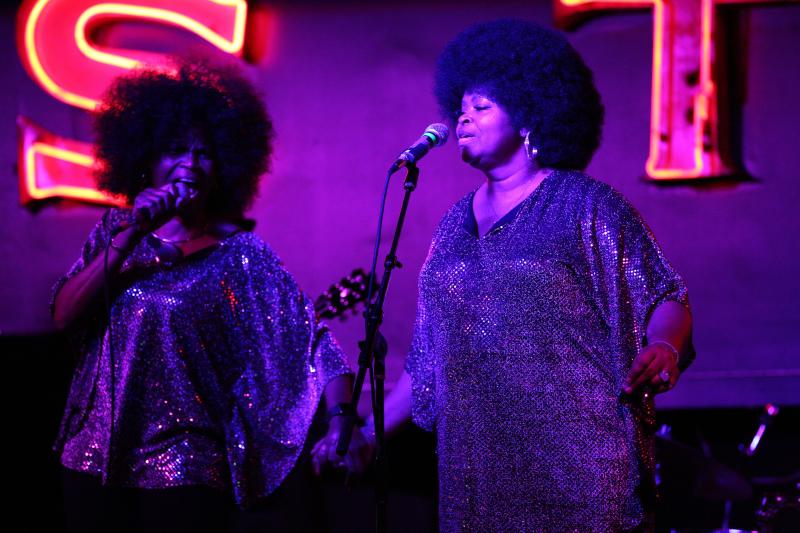 two women singing and performing at international blues challenge