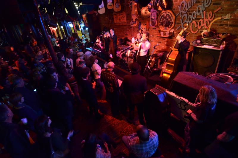 band performs in front of crowd at rum boogie during International Blues Challenge