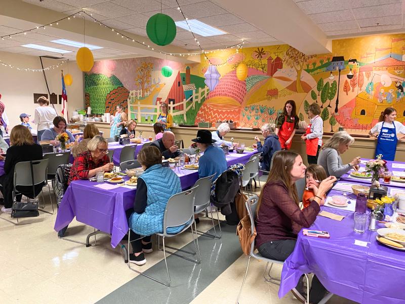 people eating at tables for Calvary Waffle Shop