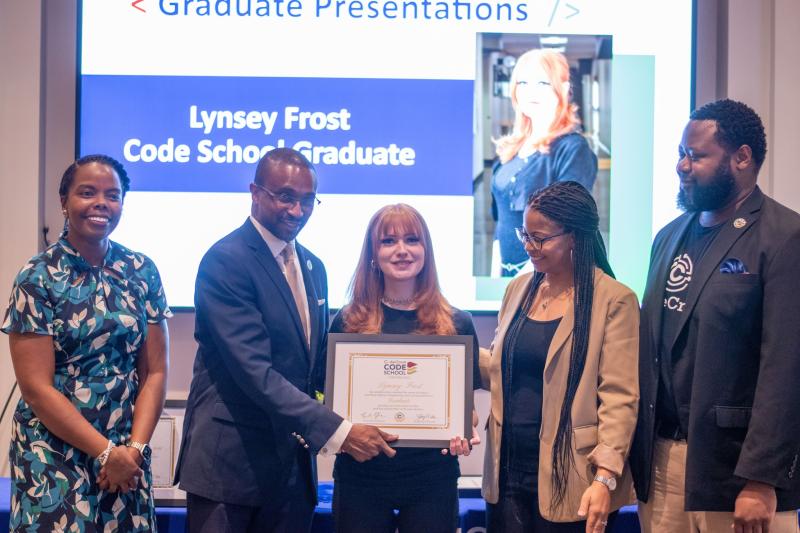 codecrew team presenting woman with certificate