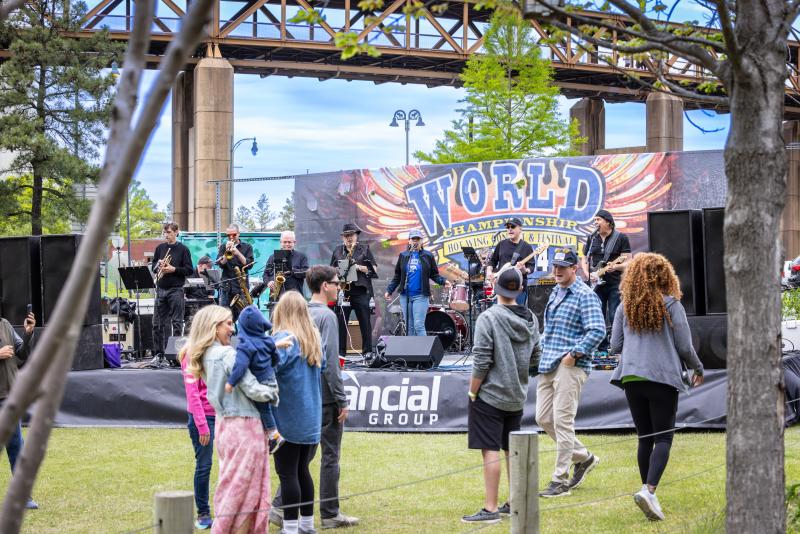 music stage set up at hot wing festival with crowd watching band performing