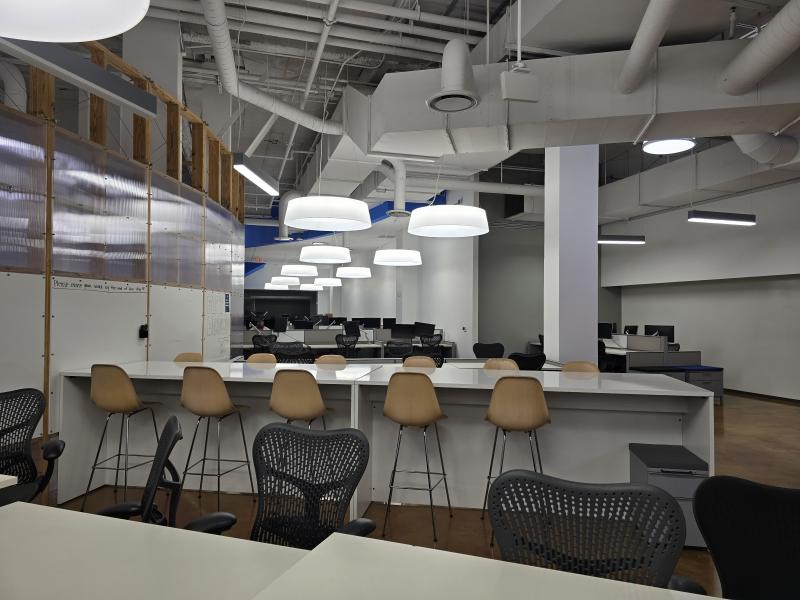 long tables for work spaces lined with chairs