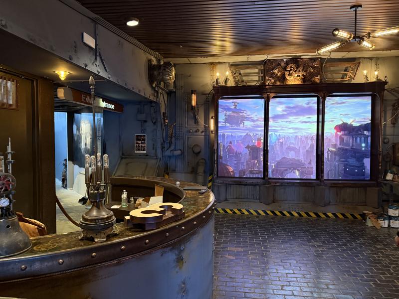 one of the futuristic rooms inside BVO with metal decor and moving screens showing a futuristic world