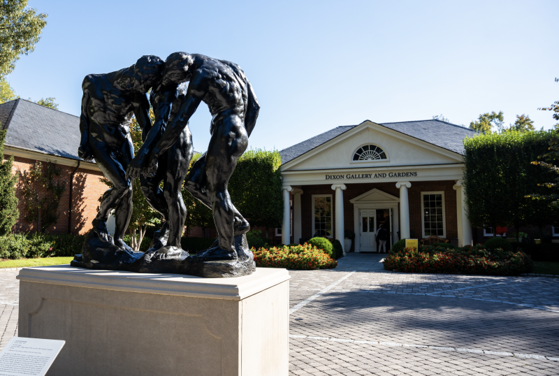 dixon exterior entrance with statue of three people hunched over