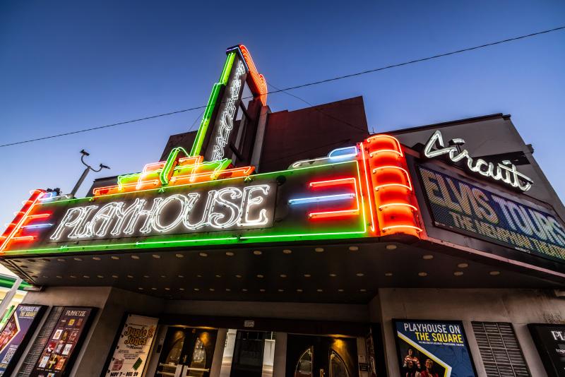 exterior neon lights of Playhouse Theatre sign