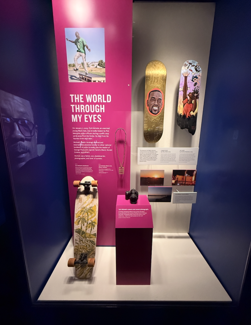 display for tyre Nichols featuring personal items such as a skateboard, camera and Black Lives Matter chain