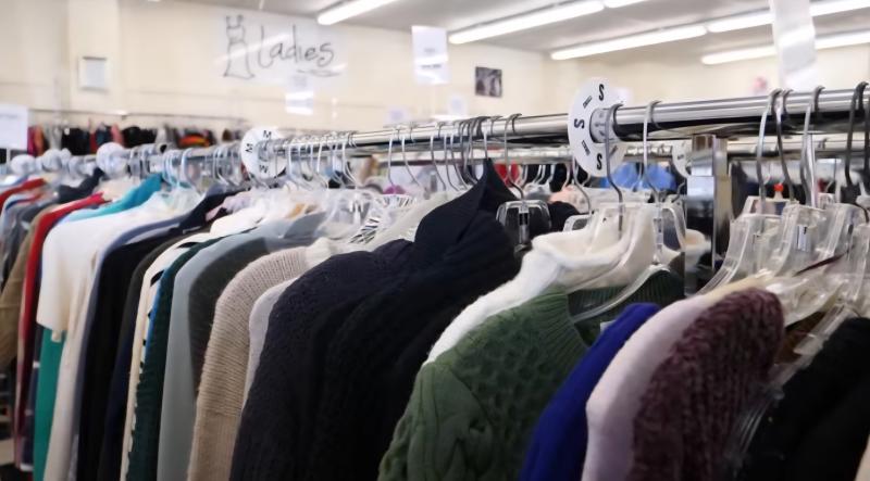 clothes hanging on rack at Repeat Boutique