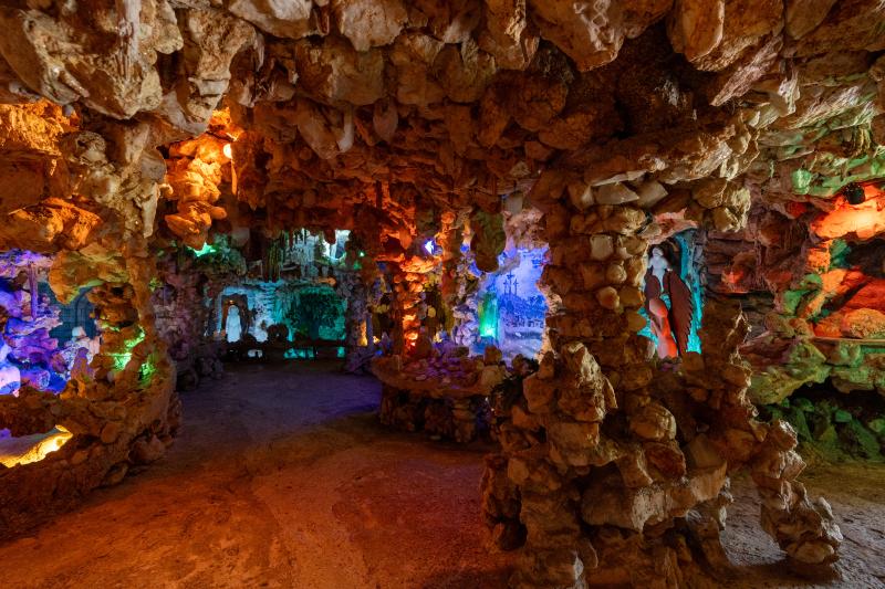 interior crystal shrine cave illuminated with colored lights