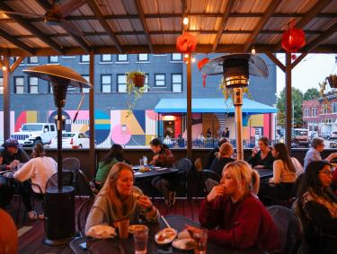 diner sit on patio of Good Fortune