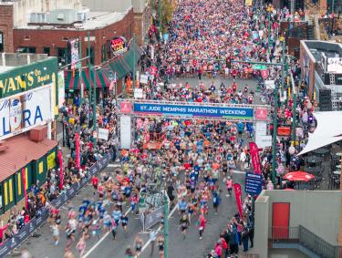 aerial photo of runners at the start of St. Jude Marathon