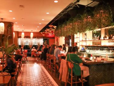 restaurant interior of Bao Toan with guests seated at tables and bar