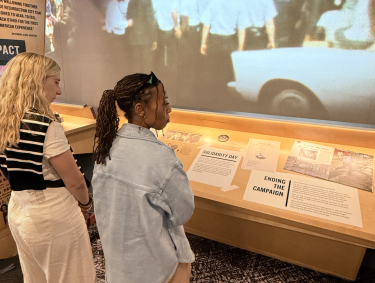 two women view poor people's campaign exhibit at NCRM's new Legacy Experience expansion
