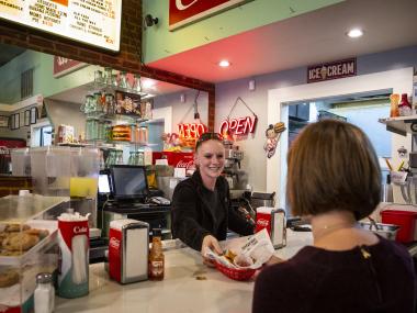 Customer being served at Dyers Hamburgers on Beale Street